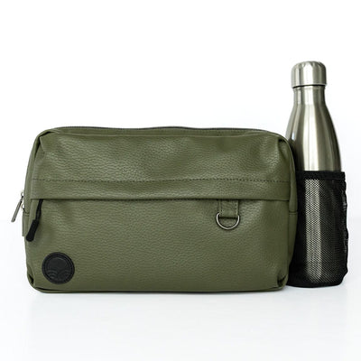 The Pack in Olive with a stainless steel bottle in its extended mesh bottle holder on a white background